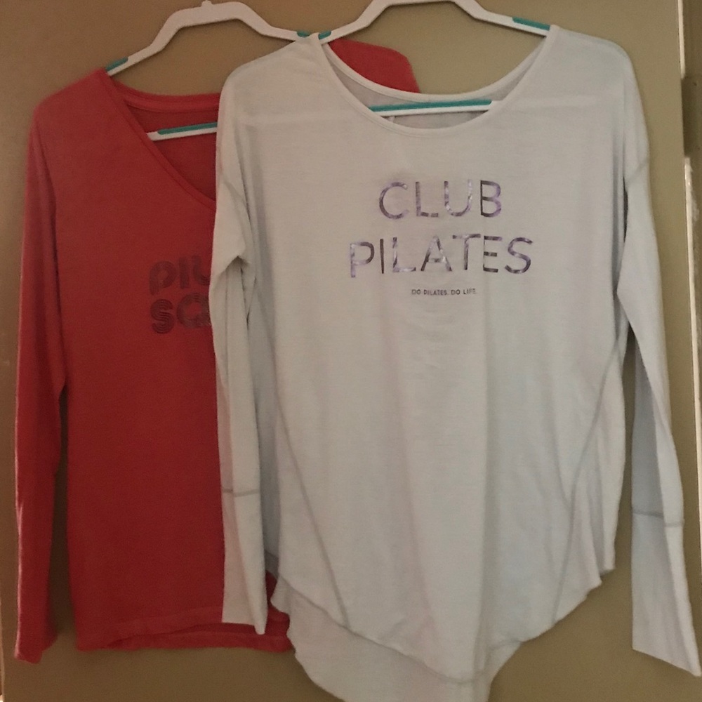 Club Pilates long sleeve shirts. Two.
